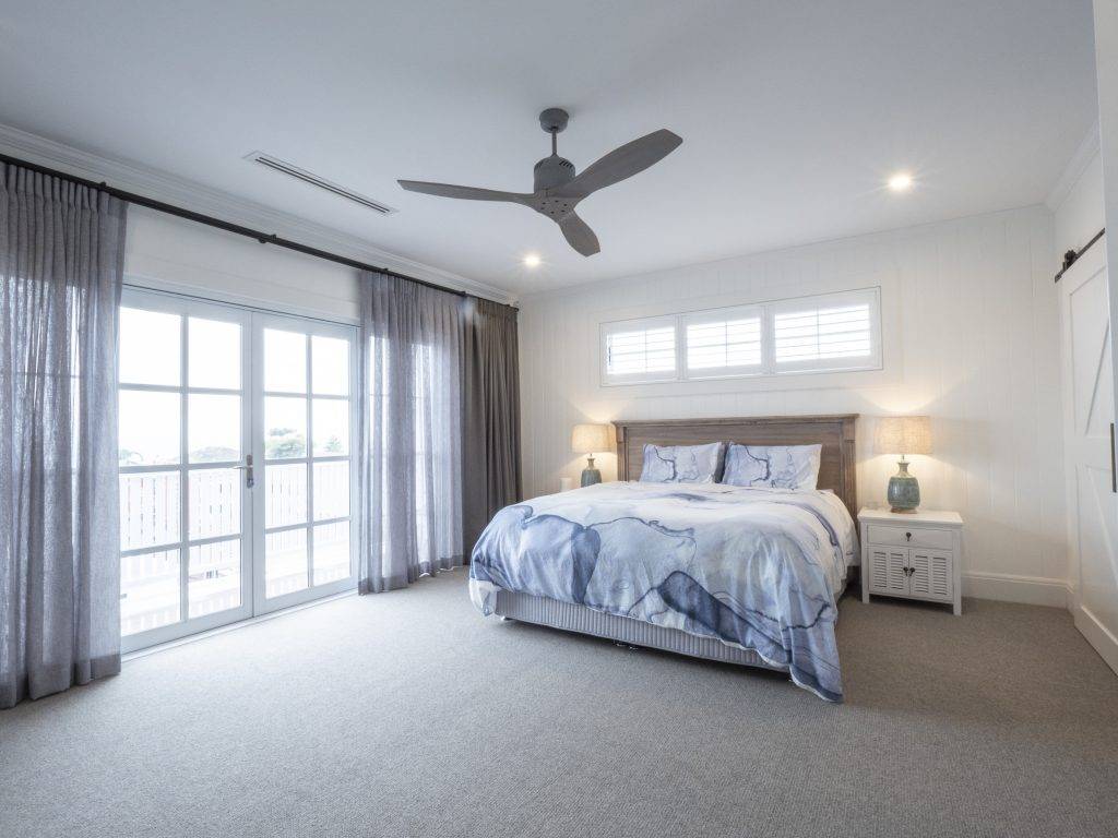 To achieve Hamptons Style: Colonial bars on the windowsPlantation shutters and;Voile curtains