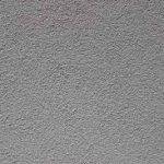 External Cladding - Upgrade Hardie Fine A close-up image of a gray, textured surface with a rough, grainy appearance.